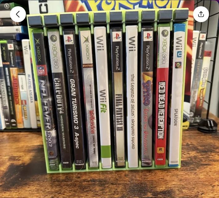 Push-button DVD game storage rack