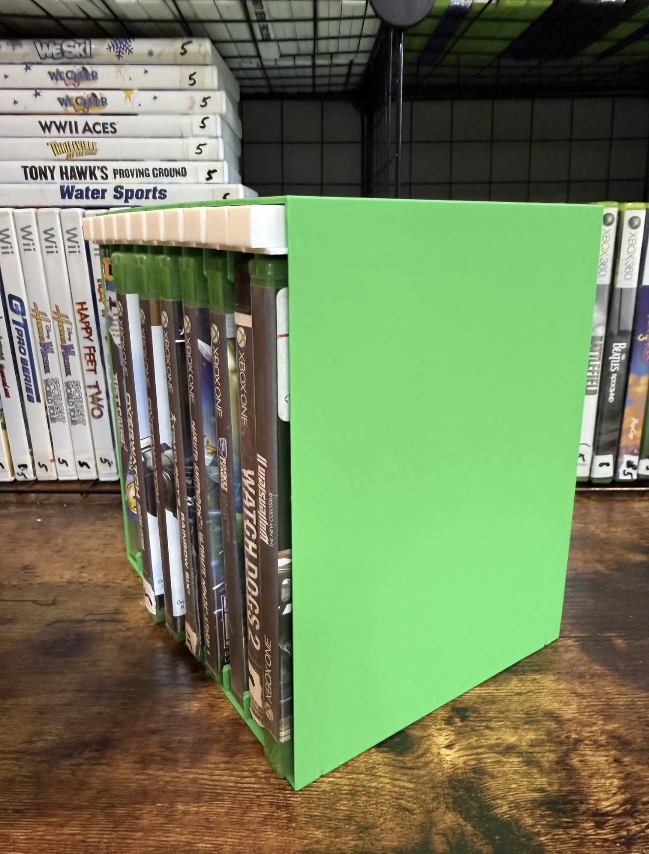 Custom push-button game storage display rack in use