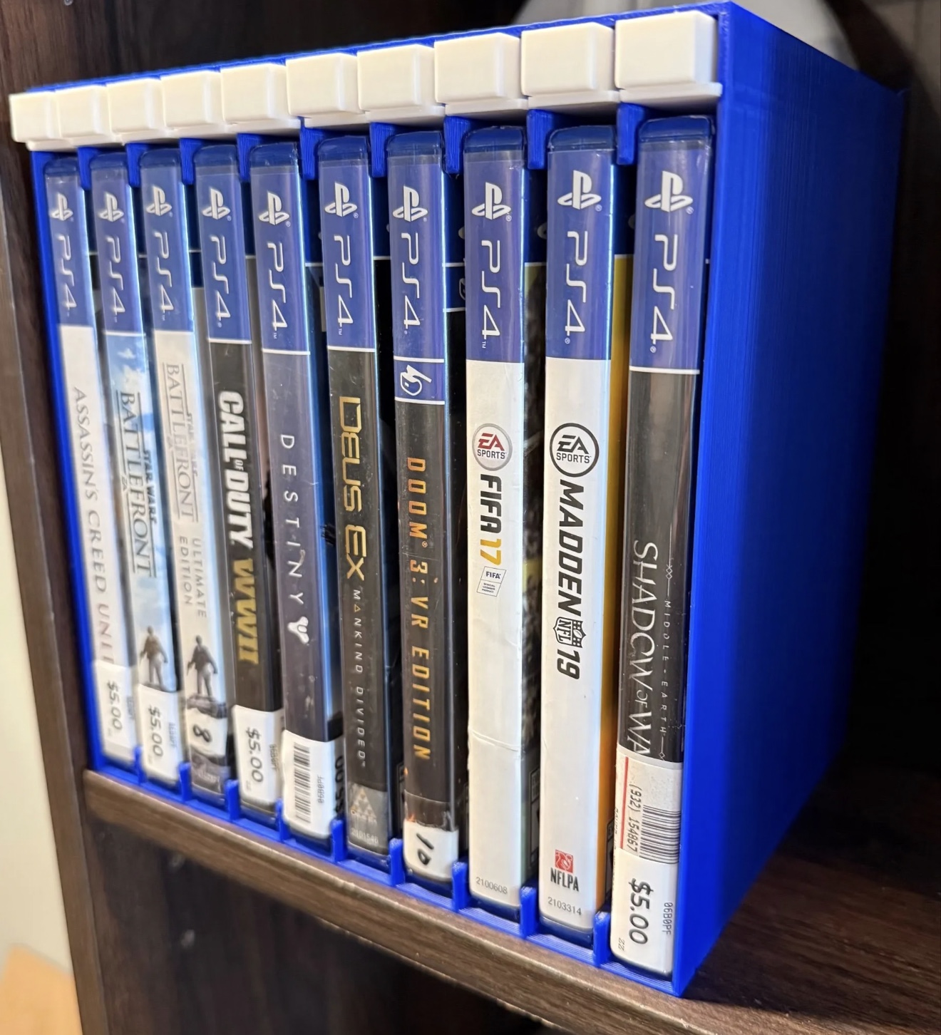Custom push-button game storage display rack showing another color combination