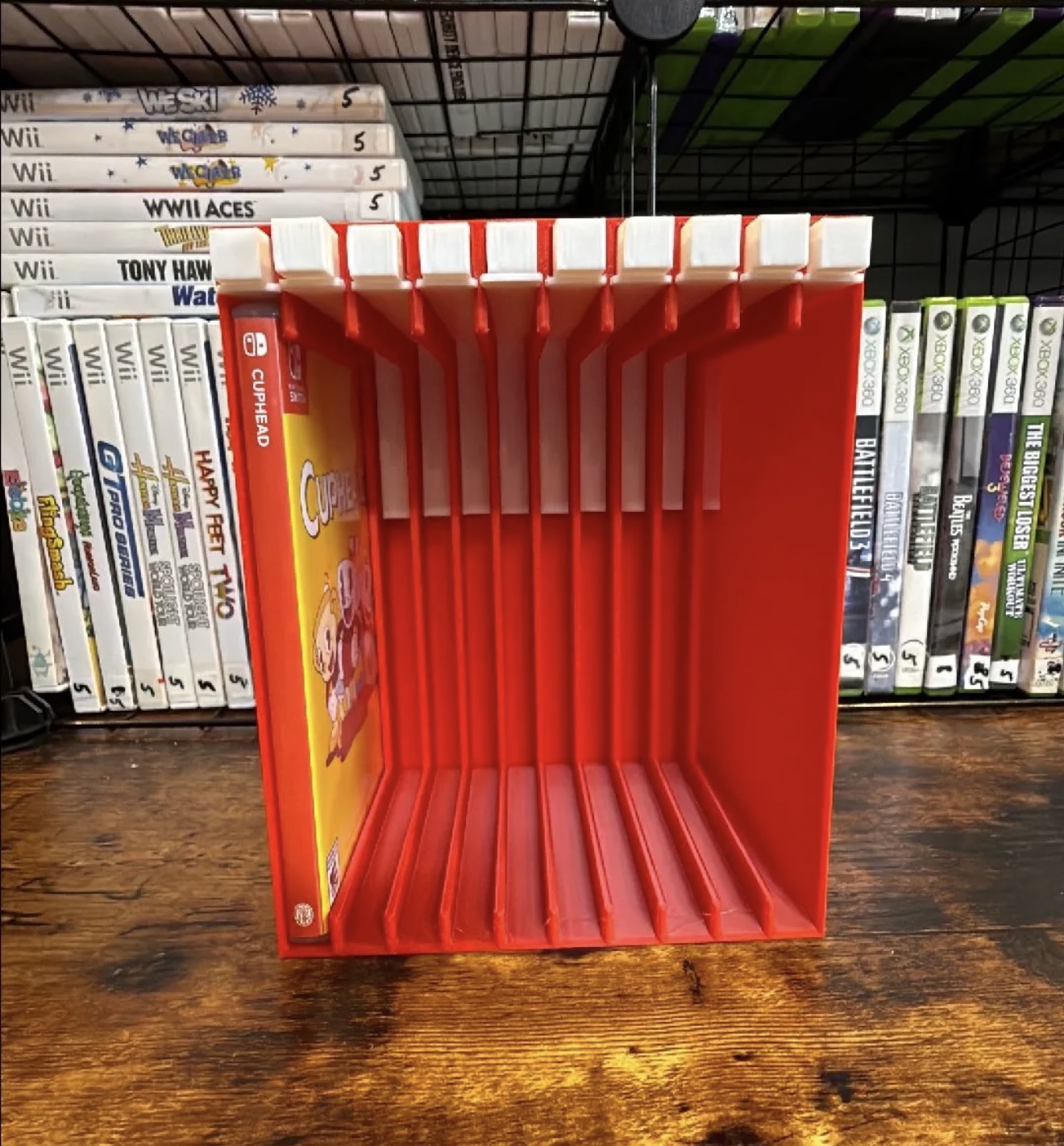 Red Nintendo Switch push-button game case storage rack